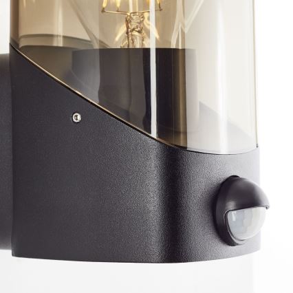 Brilliant - Udendørs væglampe med sensor MINOU 1xE27/10W/230V IP44 sort/røget