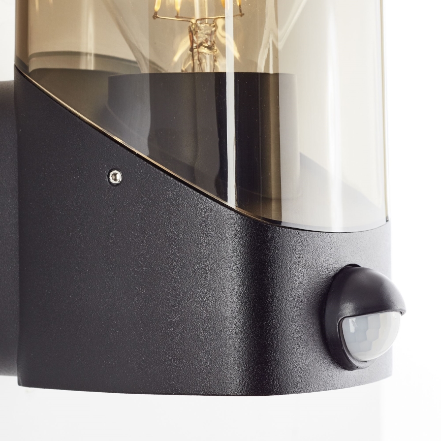 Brilliant - Udendørs væglampe med sensor MINOU 1xE27/10W/230V IP44 sort/røget