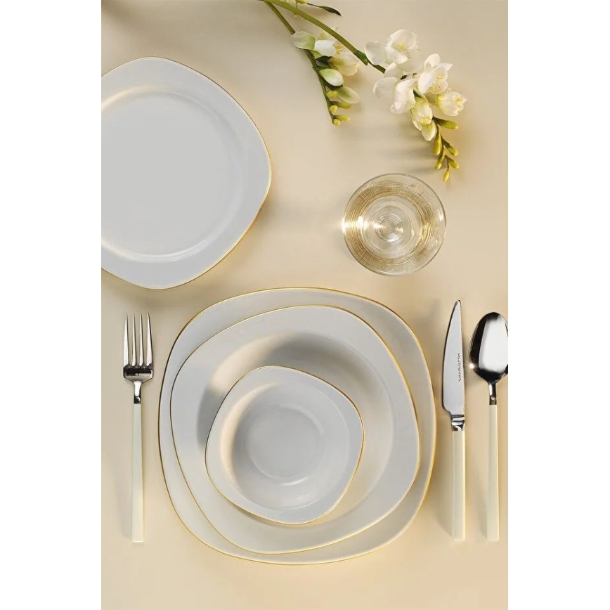 Elegant 24-delt spisesæt i hvidt porcelæn med gulddetaljer