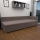 Polstret dagsseng med vendbar sengegavl og opbevaringsplads AMSTERDAM 90x200 cm beige