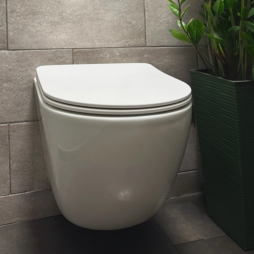 REA-C1259 - Væghængt WC med toiletsæde CARLO MINI TORNADO RIMLESS keramik/højglans hvid
