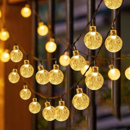 Solcelledrevet LED-dekorationskæde 50 LED / 8 funktioner 500 mAh 9,5 m IP67 varm hvid